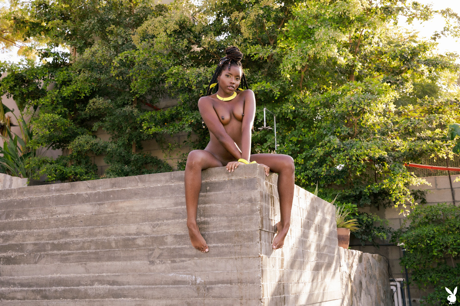 Dakota Simone shows off her exquisite figure in a tropical garden